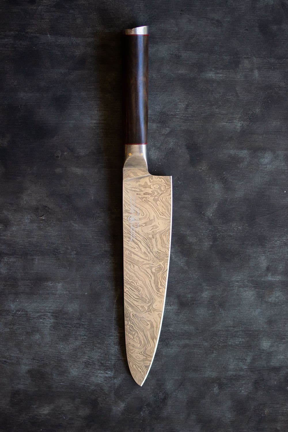 A Japanese gyuto — a long chef's knife with a pointed tip